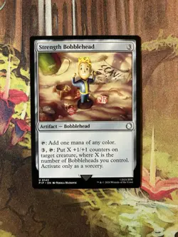 1x Strength Bobblehead NM-Mint, English Universes Beyond: Fallout MTG Magic - Image 1