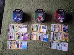 Three Pokemon TCG tins With Random Cards - Image 1