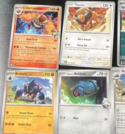 Pokemon TCG 12-Card Mixed Lot N's Darmanitan Tauros Boldore Steven's Beldum - Image 1