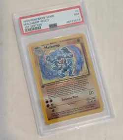 Pokemon vintage Machamp-holo 1st ED card, graded 7 - Image 1
