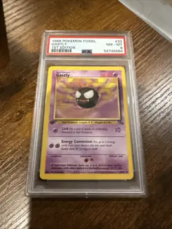 1999 POKEMON FOSSIL 1ST EDITION #33 GASTLY PSA 8 - Image 1