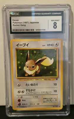 Japanese Pokemon Eevee #133 Team Rocket CGC 8 NM/Mint - Image 1