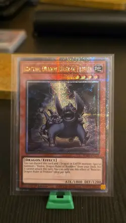 RA03-EN254 Reactan, Dragon Ruler of Pebbles, Quarter Century Secret Rare Card - Image 1