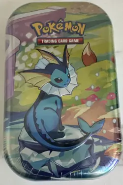 Pokemon TCG Prismatic Evolutions Vaporeon Mini Tin 60ct - Image 1
