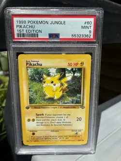 1999 Pokemon Jungle 1st Edition #60 Pikachu PSA 9 Near Mint - Image 1