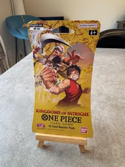 One Piece KINGDOMS OF INTRIGUE English Sleeved Booster OP-04 Sealed 12-Card Pack - Image 1
