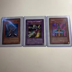 3x YuGiOh Holo BPT Lot - XYZ Dragon Cannon, Jinzo , Buster Blader - Image 1