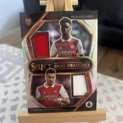 2022-23 Panini Select Premier League Dual Swatches Saka & Martinelli - Image 1