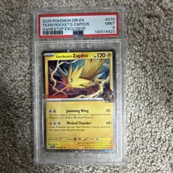 2025 POKEMON DESTINED RIVALS GAMESTOP EXCLUSIVE #070 TEAM ROCKET'S ZAPDOS PSA 9 - Image 1