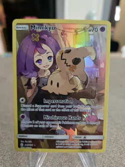 The Pokemon Company Mimikyu 245/236 Cosmic Eclipse Secret Rare Holo Full Art LP - Image 1