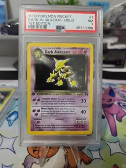 POKEMON TCG DARK ALAKAZAM TEAM ROCKET 1ST EDITION PSA 7 - Image 1