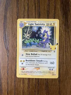 Pokemon TCG Light Toxtricity SWSH137 Celebrations Promo Card Holo LP - Image 1