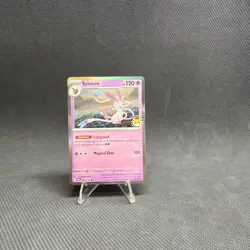 One (1) Pokemon Day 2025 Stamped Sylveon 040/131 Holo Foil Exclusive Promo Card - Image 1