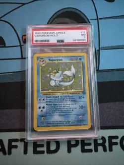 Pokemon TCG Vaporeon Jungle Set Holo Rare Card 712/64 PSA 7 - Image 1