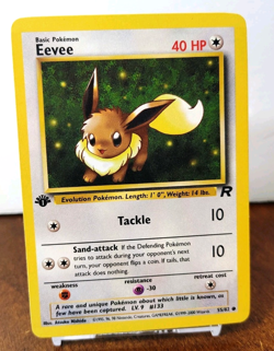 POKEMON EEVEE 55/82 1ST EDITION TEAM ROCKET MP-LP - Image 1