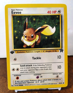 POKEMON EEVEE 55/82 1ST EDITION TEAM ROCKET LP - Image 1