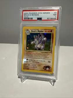 PSA 7 - 2000 POKEMON GYM HEROES #2 BROCK'S RHYDON HOLO - Image 1