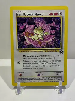 Team Rocket's Meowth Black Star Promo Pokemon Card - Image 1