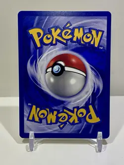 Team Rocket's Meowth Black Star Promo Pokemon Card - Image 2