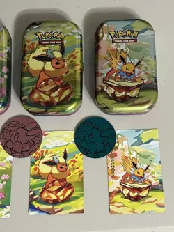Pokemon- Prismatic Evolutions *EMPTY* Mini Tins, Set of 4 with Cards and Coin! - Image 2