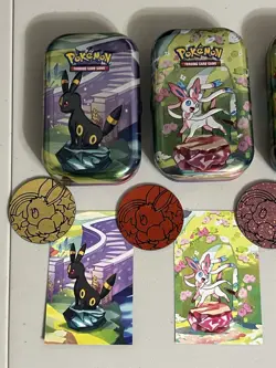 Pokemon- Prismatic Evolutions *EMPTY* Mini Tins, Set of 4 with Cards and Coin! - Image 3