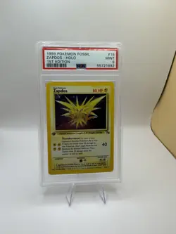 1999 POKEMON FOSSIL 1ST EDITION #15 ZAPDOS-HOLO PSA 9 - Image 1