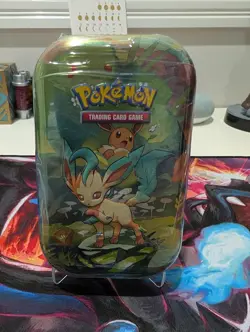 Factory Sealed Prismatic Evolutions Leafeon Mini-Tin Pokemon TCG Scarlet Violet - Image 1