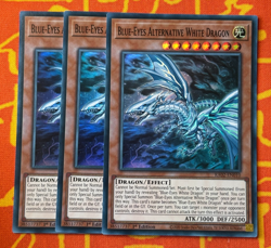 YUGIOH BLUE-EYES ALTERNATIVE WHITE DRAGON SUPER RARE EXC RA02-EN010 x3 PLAYSET - Image 1