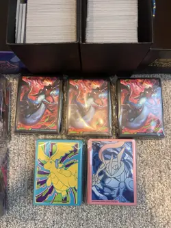 (2) Pokemon TCG Bulk Cards in ETB's , Sleeves, Playmats, And Deck Boxes - Image 4