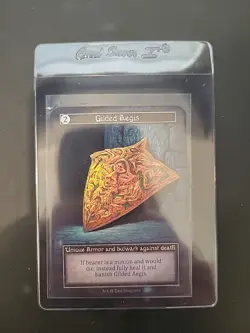 Gilded Aegis Sorcery Contested Realm Alpha Unique Foil - Image 1