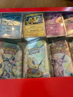 Pokemon Prismatic Evolutions 8 Mini-Tins with Promo Cards - Image 3
