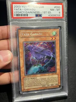 PSA 8 NM-MT Yata Garasu LOD-000 Secret Rare 1st Edition HOLO BLEED Yugioh - Image 1