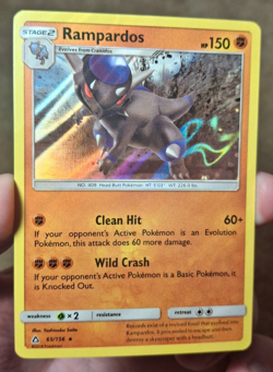 2018 POKEMON SM ULTRA PRISM SET RAMPARDOS HOLO CARD 65/156 - Image 1