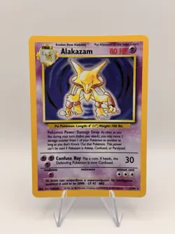 1999 Pokemon Base Set Alakazam 1/102 Holo Rare WOTC Vintage Trading Card - MP - Image 1