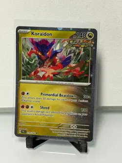Koraidon 119/162 - Cosmos Holo Rare SV: Temporal Forces Pokemon - Image 1