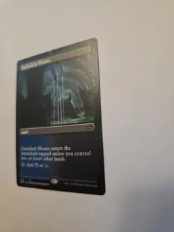 Darkslick Shores (Borderless) Phyrexia: All Will Be One Regular - Image 2