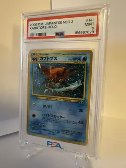 Kabutops - Neo2 Crossing the Ruins... Holo (Japanese) - No. 141 - PSA 9 - Image 1