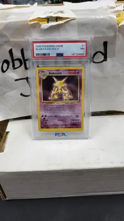 1999 ALAKAZAM HOLO RARE BASE SET POKEMON TCG PSA 7 NEAR MINT #1/102 - Image 1