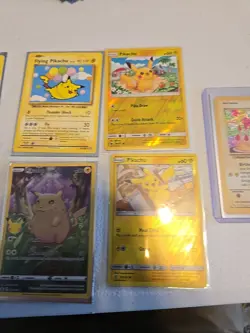 Lot Of 12 Pikachu Pokemon Cards Holo Reverse Holo Vmax And V - Image 1