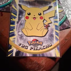 A surprise item + a Topps Pokemon #25 Pikachu TV Animation Edition Series MINT - Image 1