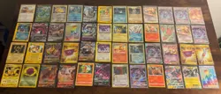 Pokemon Modern Card Lot x48 - Charizard Holo, Naganadel GX, Gold, Mewtwo + More - Image 1