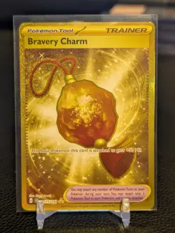 Bravery Charm 175/142 Gold Hyper Rare 2024 Pokemon Stellar Crown Card NM - Image 1