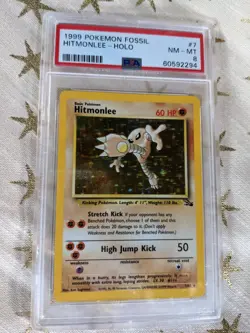 1999 Pokemon Fossil Hitmonlee Holo 7/62 PSA Graded NM-MT 8 - Image 1
