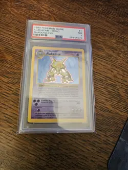 1999 POKEMON BASE SET SHADOWLESS #1 ALAKAZAM-HOLO PSA 7 - Image 1