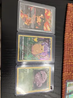 Pokemon TCG 3-Card Lot Pikachu 005/025, Numel 223/217, Dark Weezing 31/82 - Image 1
