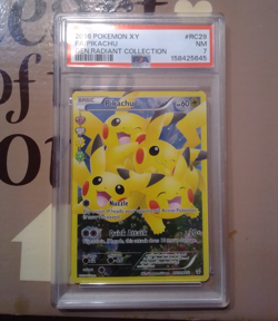 The Pokemon Company PSA 7 2016 Pikachu RC29-32 Radiant Collection Full Art Holo - Image 1