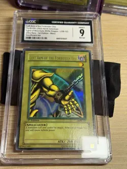 Yugioh CGC 9 Left Arm of the Forbidden One LOB-123 1st Edition Wavy Faded Mint - Image 1