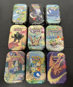 Lot of 9 Pokemon TCG Collectible Mini Tins EMPTY - Charizard, Pikachu, Celebi - Image 1
