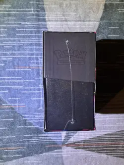 Pokemon Pitch Black Pokemon Center Elite Trainer Box ETB in hand - Image 4