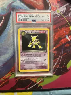 2000 POKEMON ROCKET 1ST EDITION #1 DARK ALAKAZAM-HOLO PSA 8 - Image 1